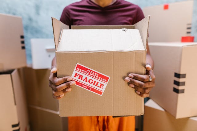 hands-holding-moving-box